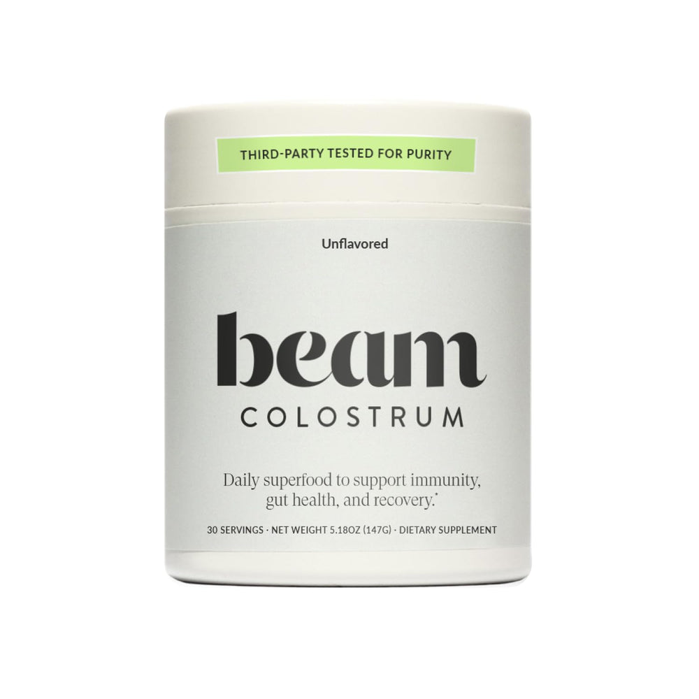 Beam Colostrum Powder 3g serving scoop may support immune health and digestive comfort.