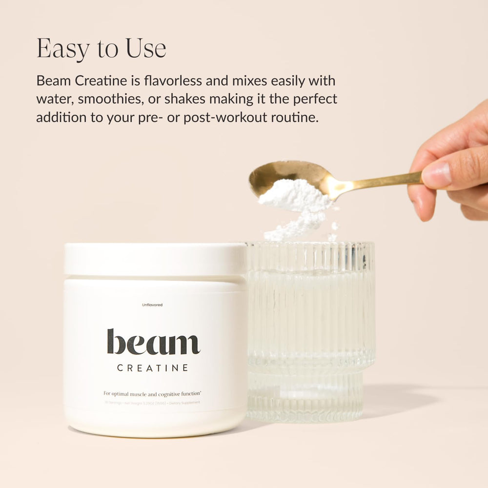 Beam Creatine Powder mixed beverage in glass shows easy dissolution for workouts.