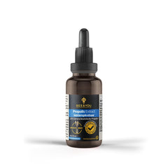 Bee & You propolis drops being added to a glass of water