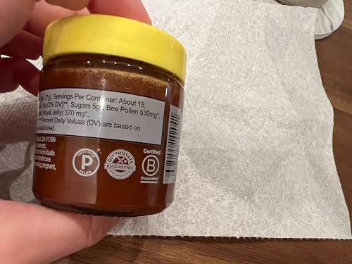 Beekeeper's Naturals Superfood Honey tasting on wooden spoon for natural sweetness