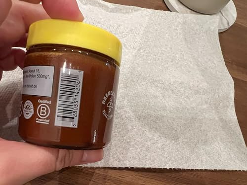 Beekeeper's Naturals Superfood Honey bottle with measuring spoon for precise use