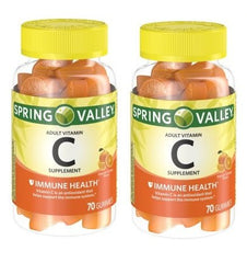 BELOEN Spring Valley Vitamin C gummies, orange flavor, shown in a bottle pour for easy daily use.