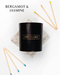 Benevolence LA Bergamot Jasmine candle lit glow creates intimate living room mood.