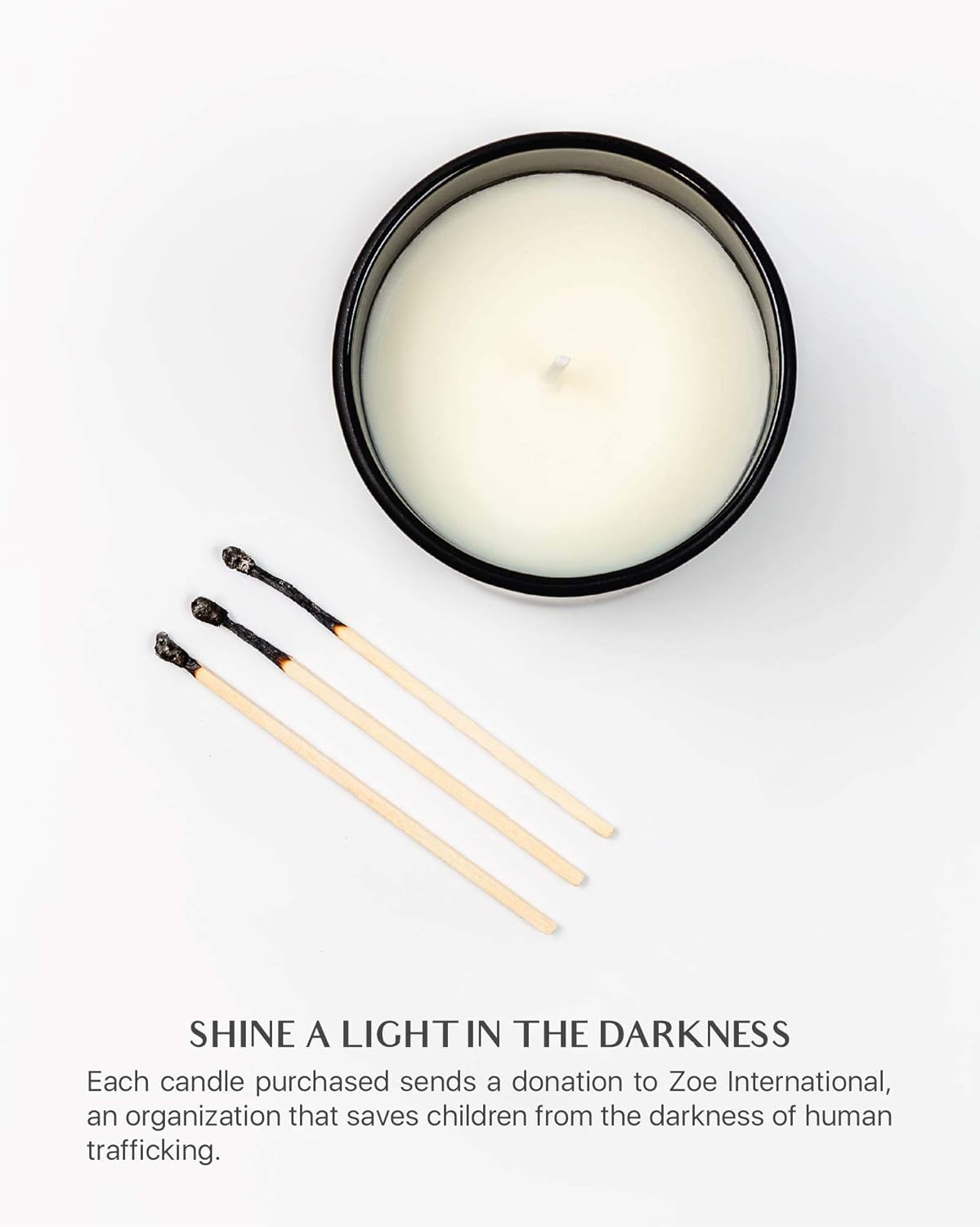 Benevolence LA candle in black jar with lid for a gift-ready look.