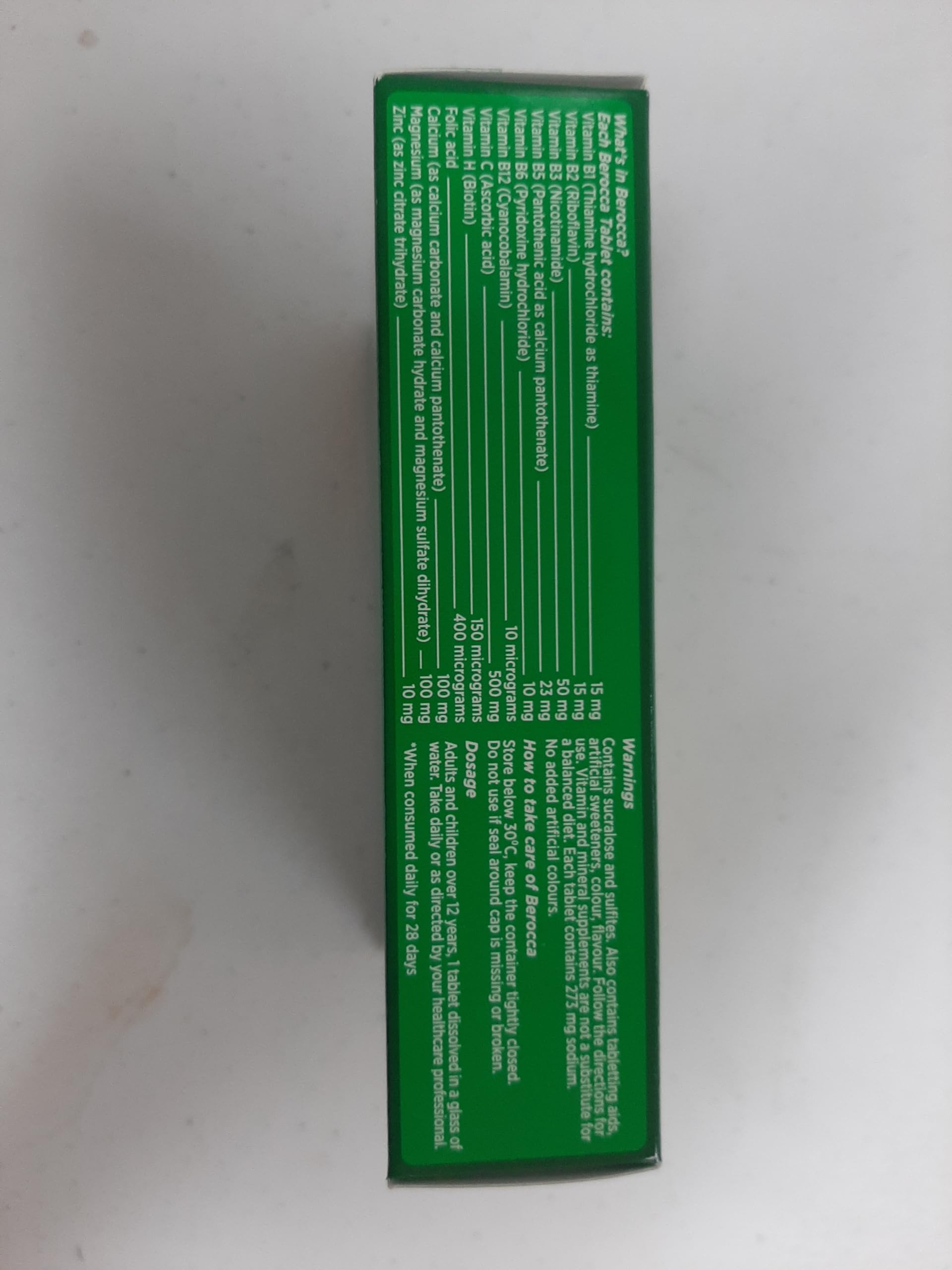 Berocca Energy glass with dissolved tablets showing effervescent action.
