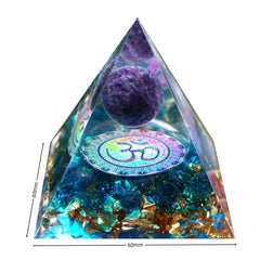 Besorgone orgonite pyramid with blue quartz stones in decorative setup