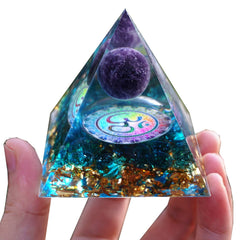 Besorgone orgonite pyramid on a work desk for ambient energy balance