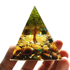 Besorgone Peridot Pyramid on desk for focus and calming energy.