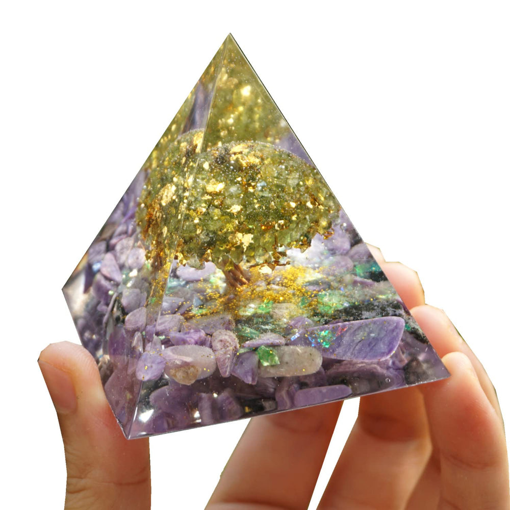 Besorgone tree of life orgonite pyramid displayed on a desk for calm ambiance.