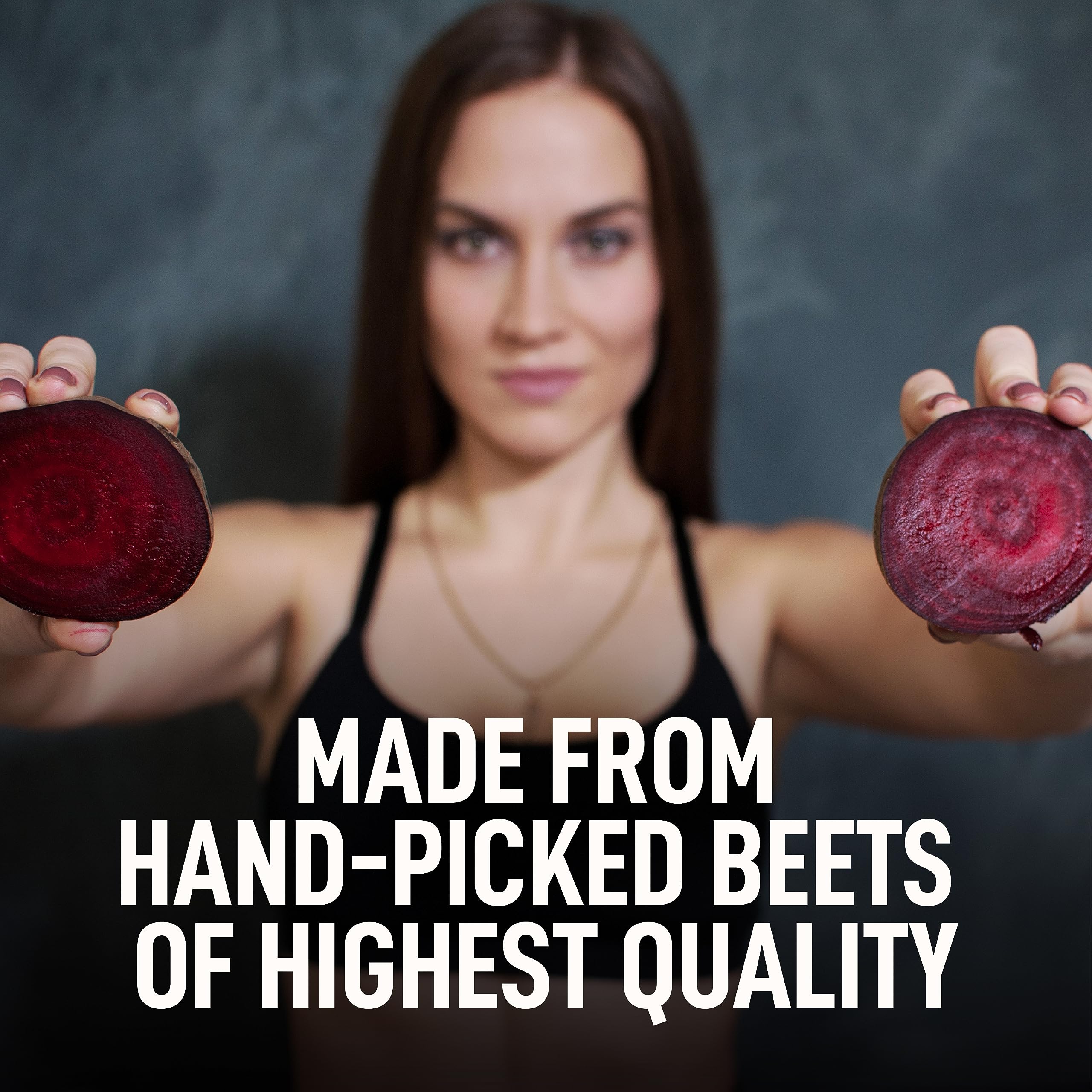 Better Alt beet root powder being poured with a teaspoon into a smoothie.