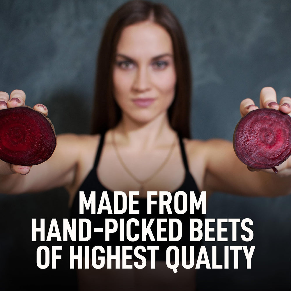Better Alt beet root powder being poured with a teaspoon into a smoothie.