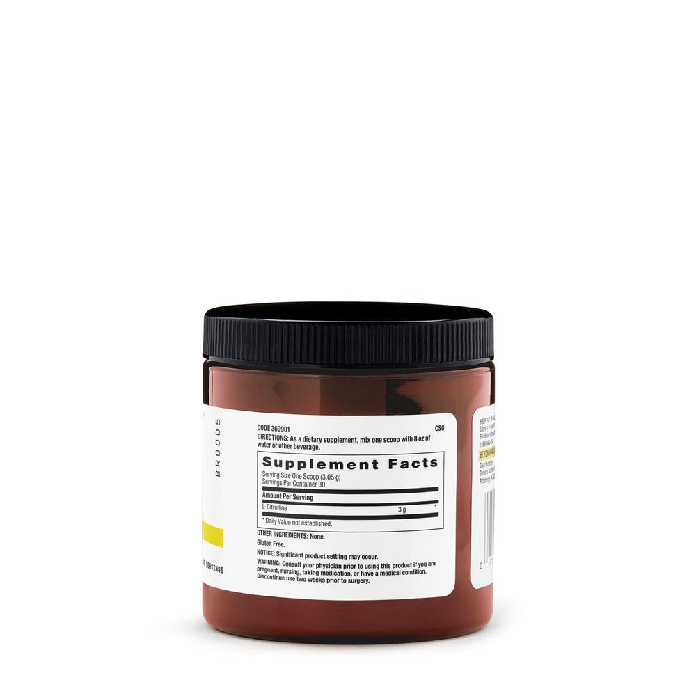 Pouring BEYOND RAW L-Citrulline powder into a shaker for a customizable pre-workout.