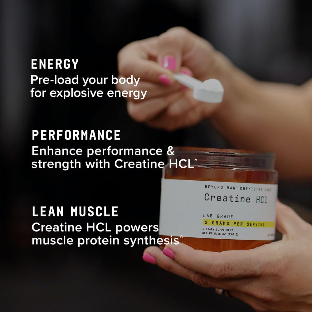 Beyond Raw Creatine HCl powder bottle on wood table evokes premium lab-grade nutrition.