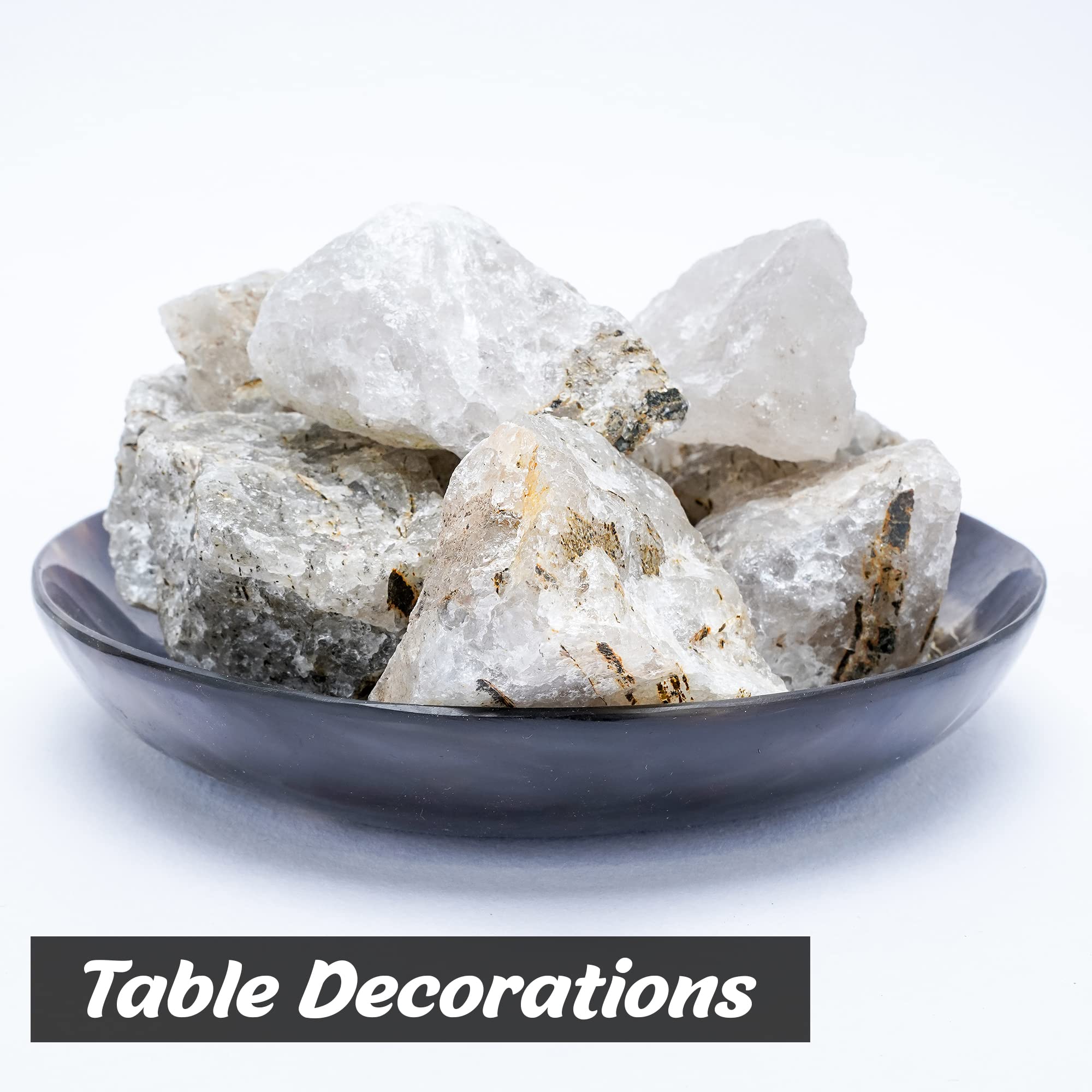 BEZAVO Black Rutile rough stones on a workspace ready for crafting.