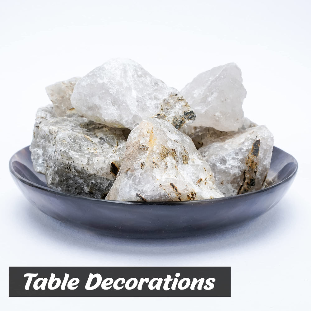 BEZAVO Black Rutile rough stones on a workspace ready for crafting.