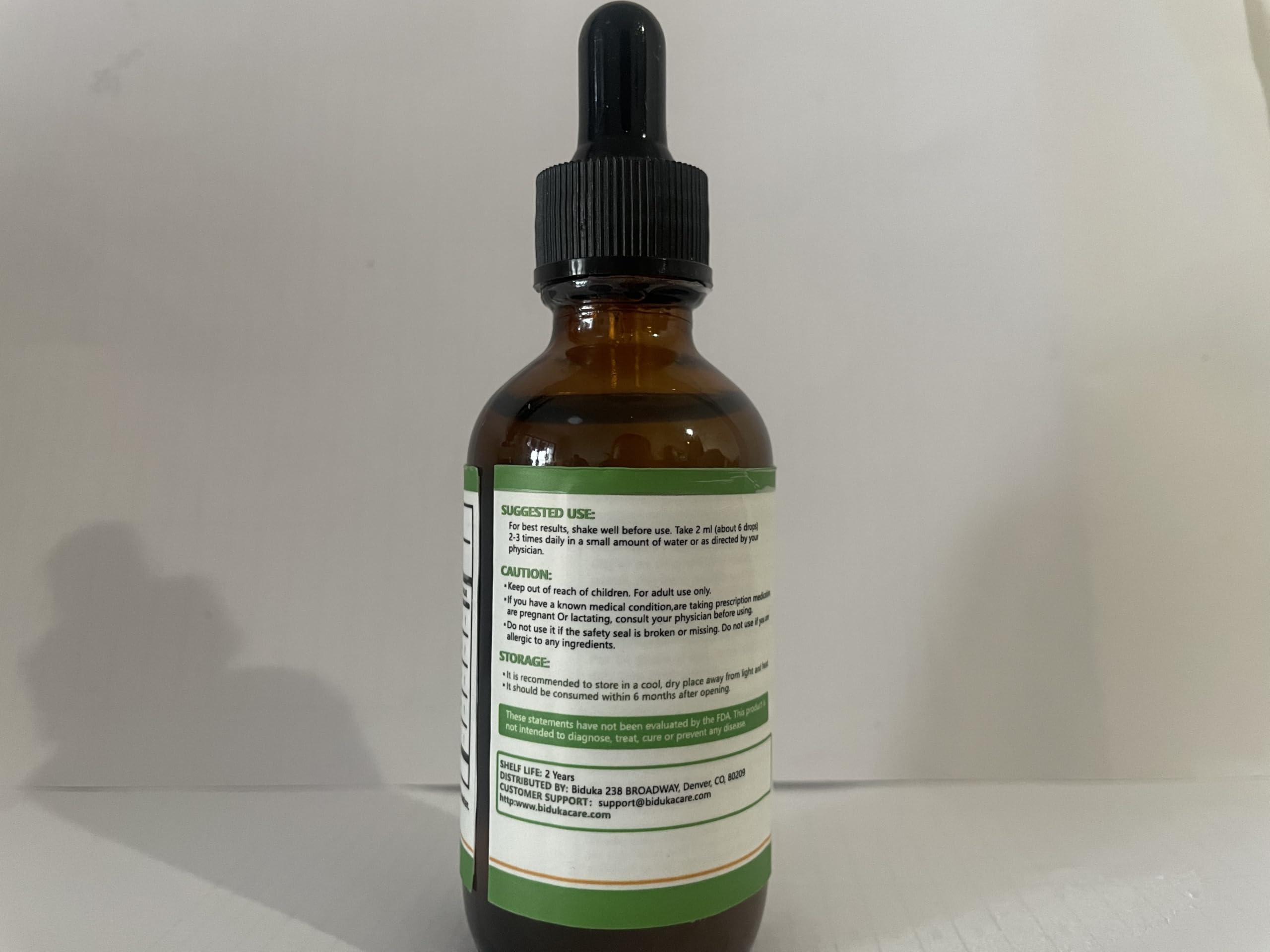 Biduka Daily-use drops shown with water, perfect for quick mornings.