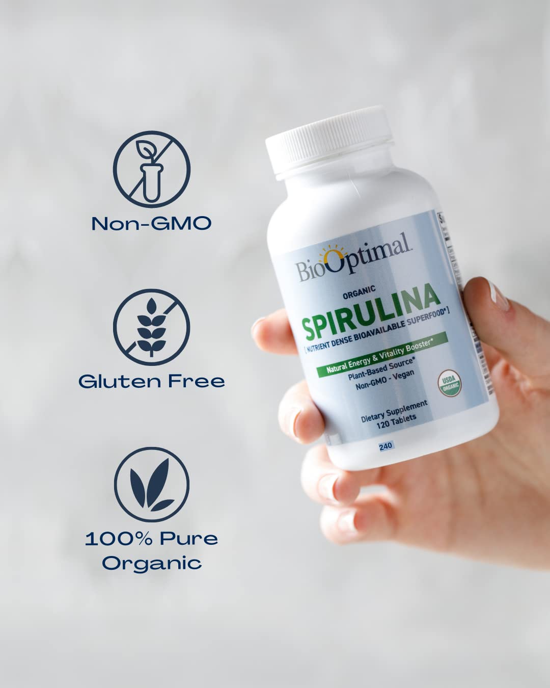 BioOptimal Spirulina Tablets beside a glass suggests an easy daily supplement routine.