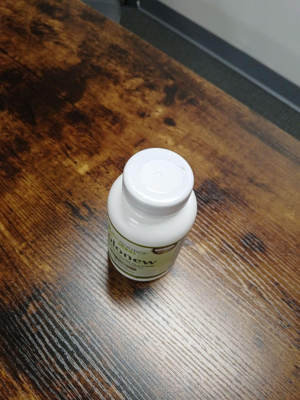 BioSource Labs Colonew bottle beside fruits supporting nutrient absorption.