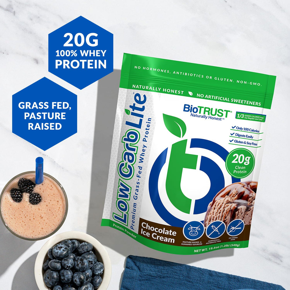 BioTrust Low Carb Lite whey protein powder being scooped for a quick low-carb snack.