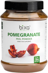 Bixa Botanical Pomegranate Peel Powder in a tin, ideal for smoothies and skincare.