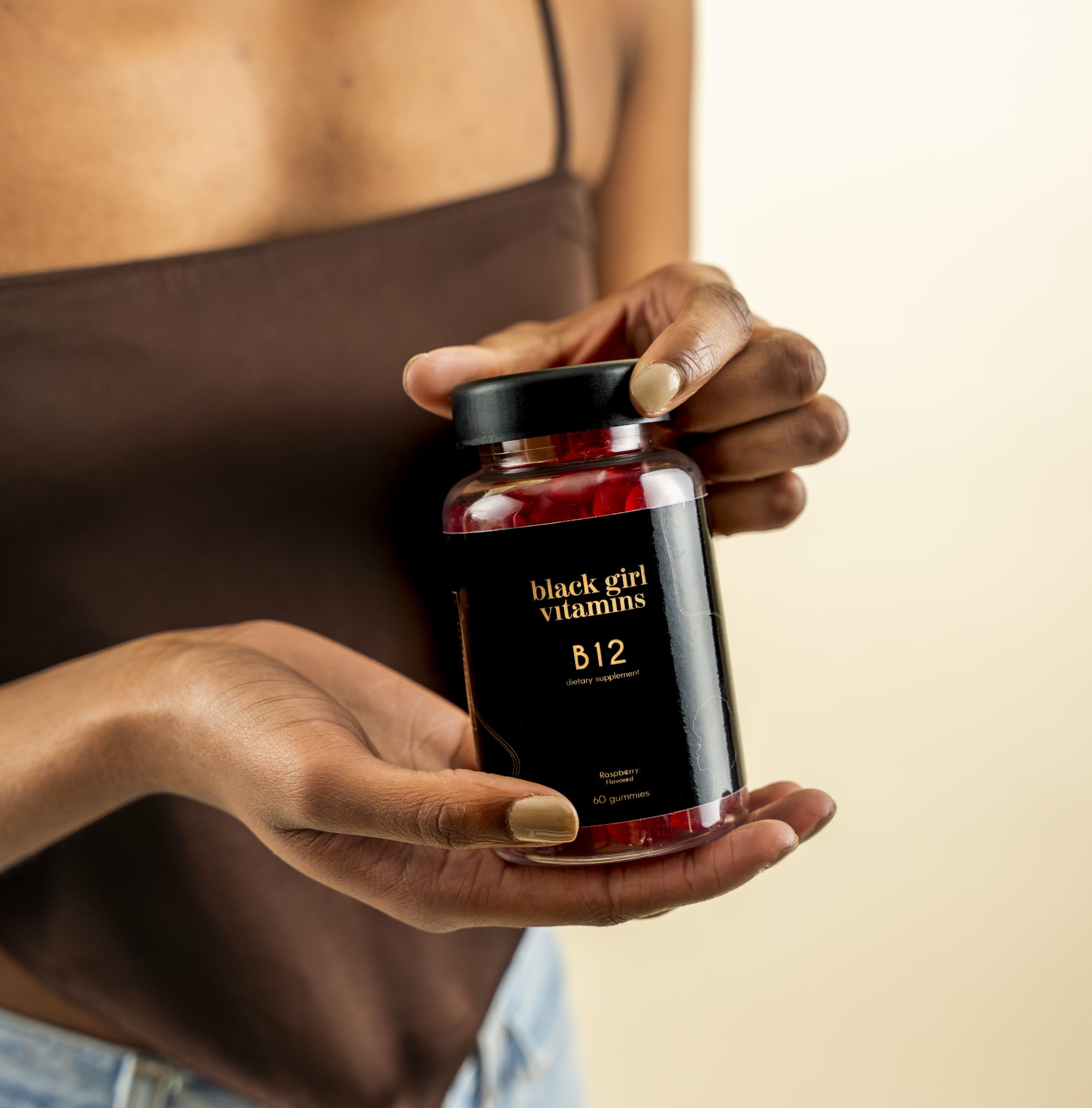 60-count bottle of Black Girl Vitamins B12 gummies on a kitchen counter.