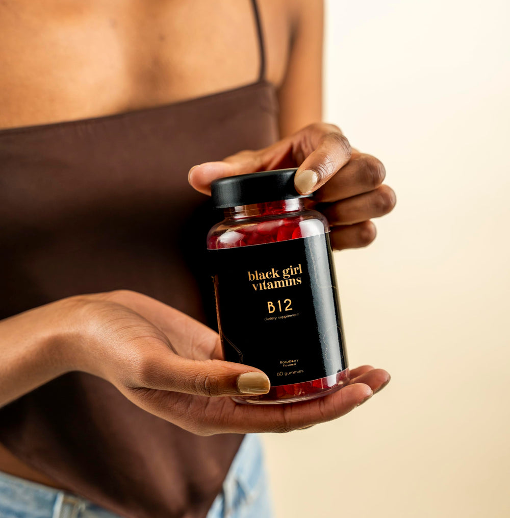 60-count bottle of Black Girl Vitamins B12 gummies on a kitchen counter.