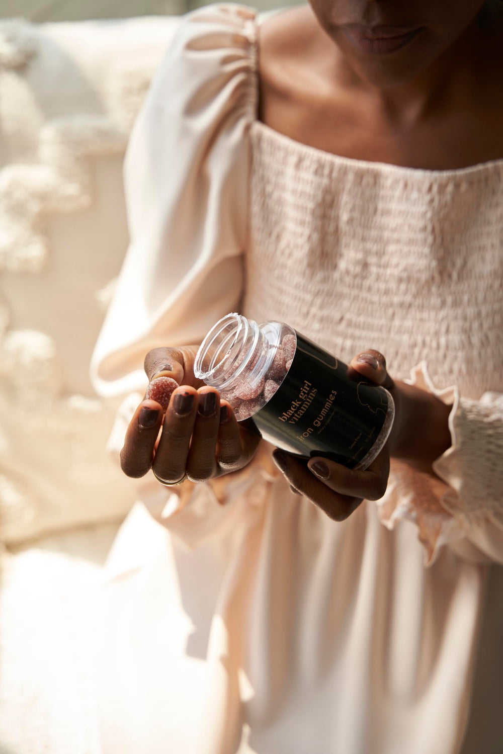 Black Girl Vitamins Iron Gummies label detail with 60-count bottle.