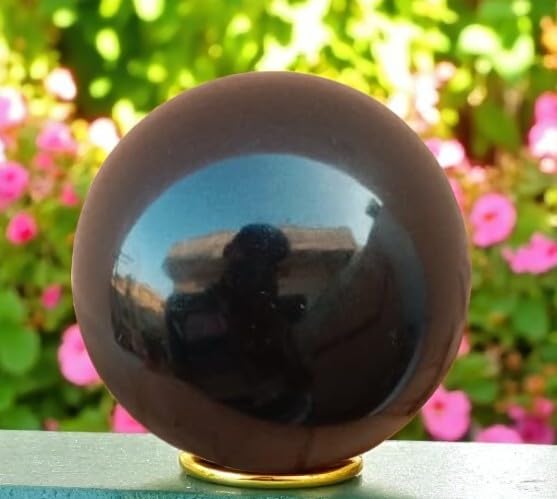 Black Obsidian sphere for divination reflections, exploring inner truths.