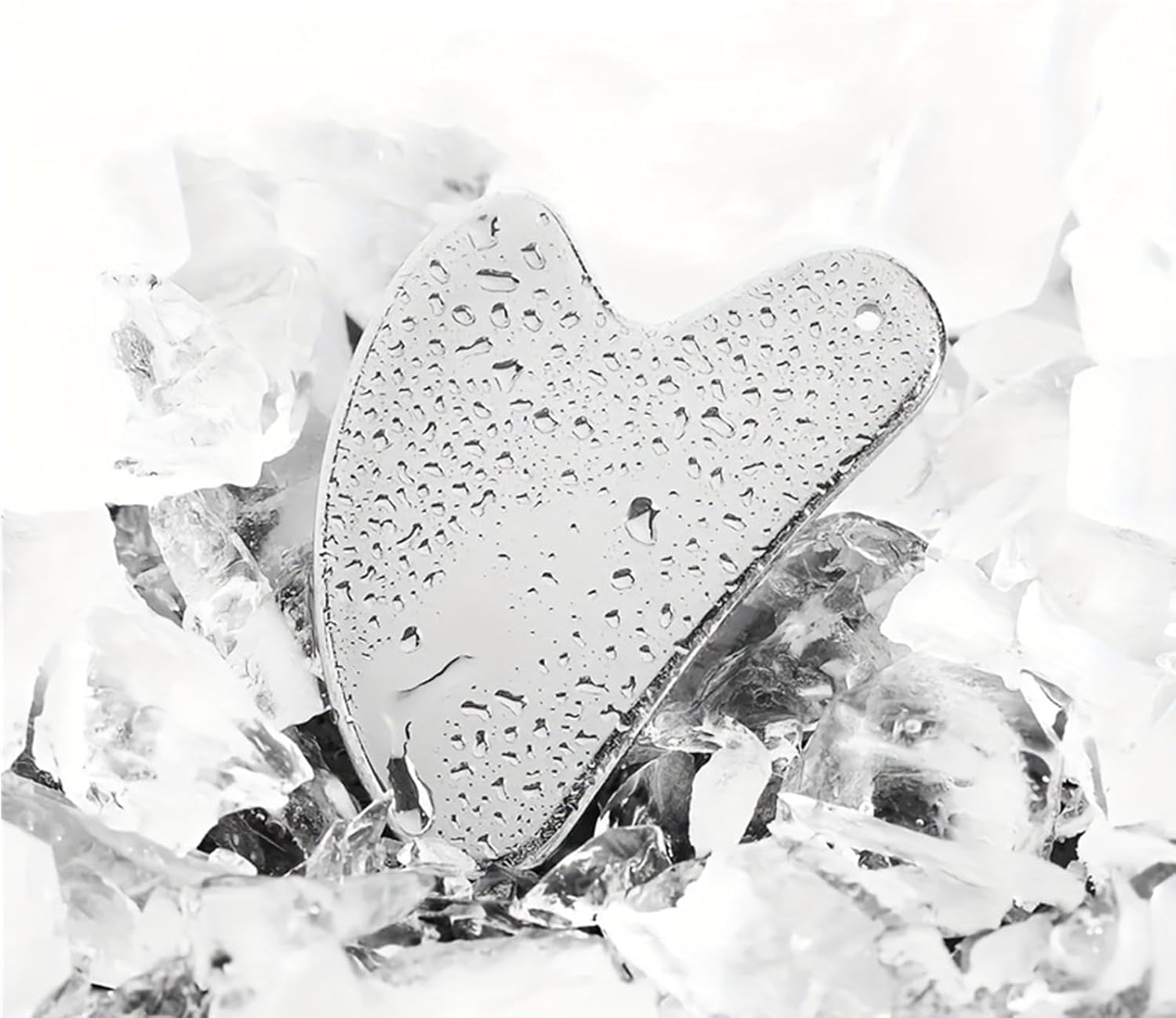 BLHVSINO1 cooling gua sha tool to enhance absorption when used with serums.