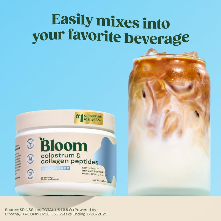 Bloom Nutrition bovine colostrum powder scoop beside a glass for easy daily mixing