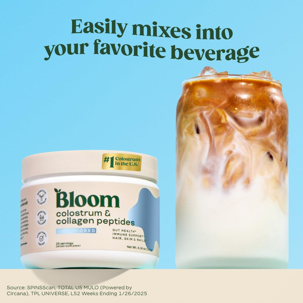 Bloom Nutrition bovine colostrum powder scoop beside a glass for easy daily mixing
