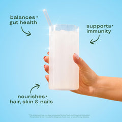 Bloom Nutrition bovine colostrum powder scoop demonstrates easy daily use for gut health.