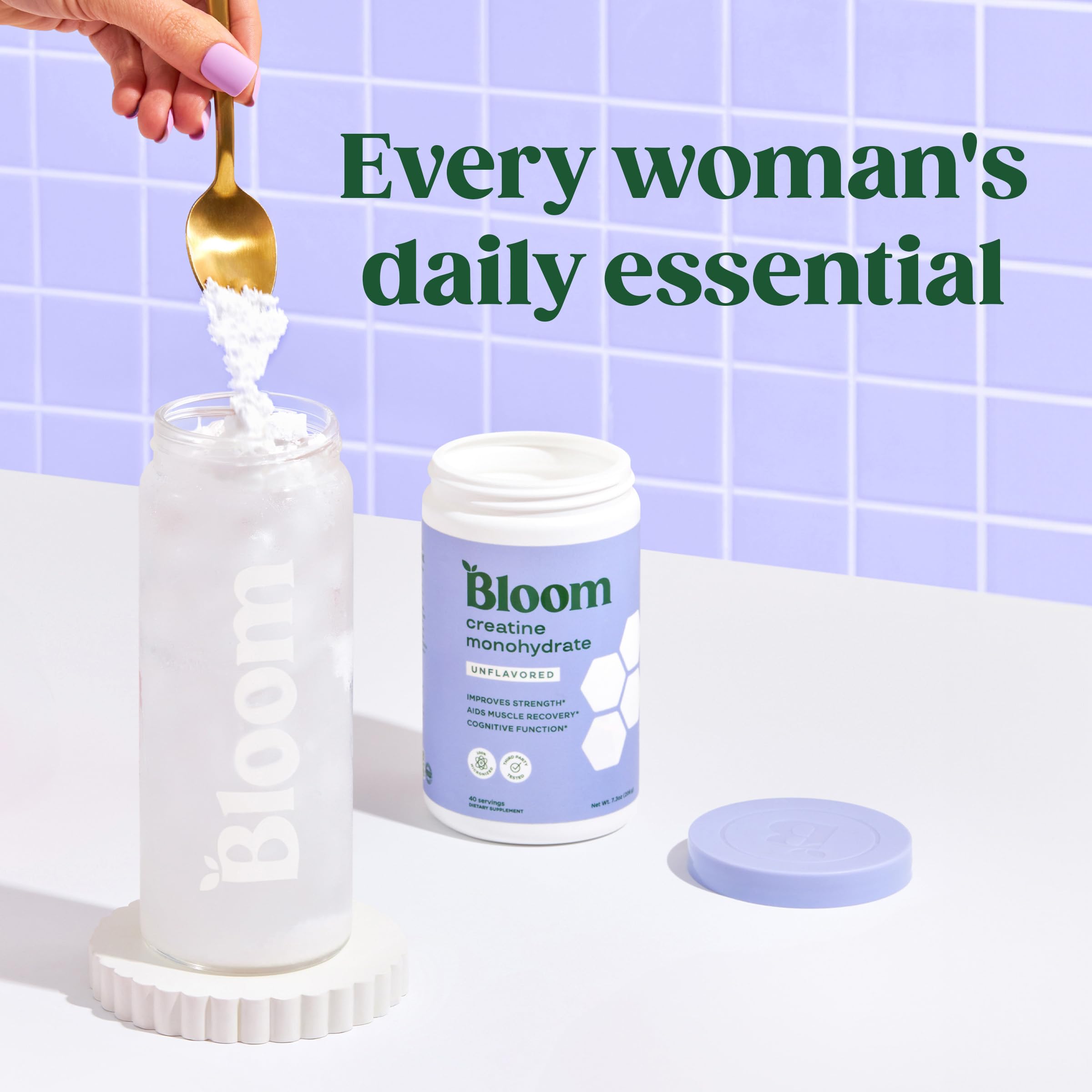 Glass of water shows creatine dissolving clearly with Bloom Nutrition Monohydrate.