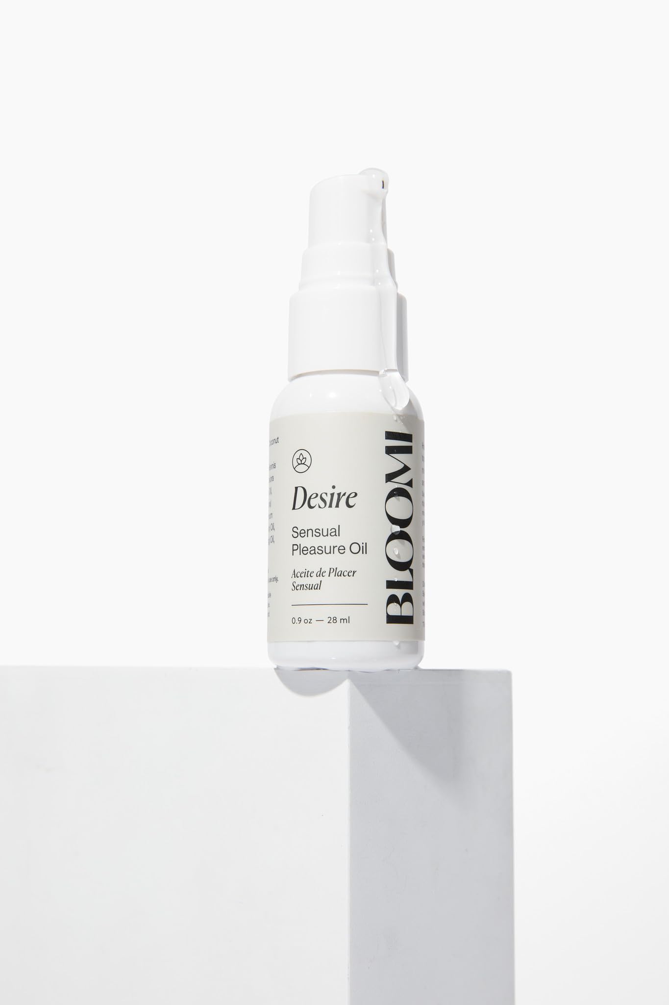 Bloomi Desire Body Oil applied to skin for hydration and softness.