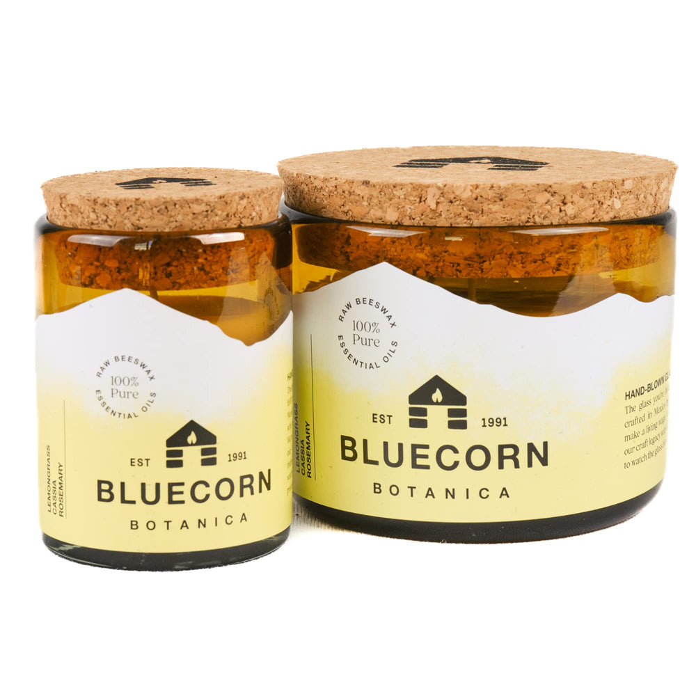 Bluecorn Beeswax amber glass close-up with natural cotton wicks.