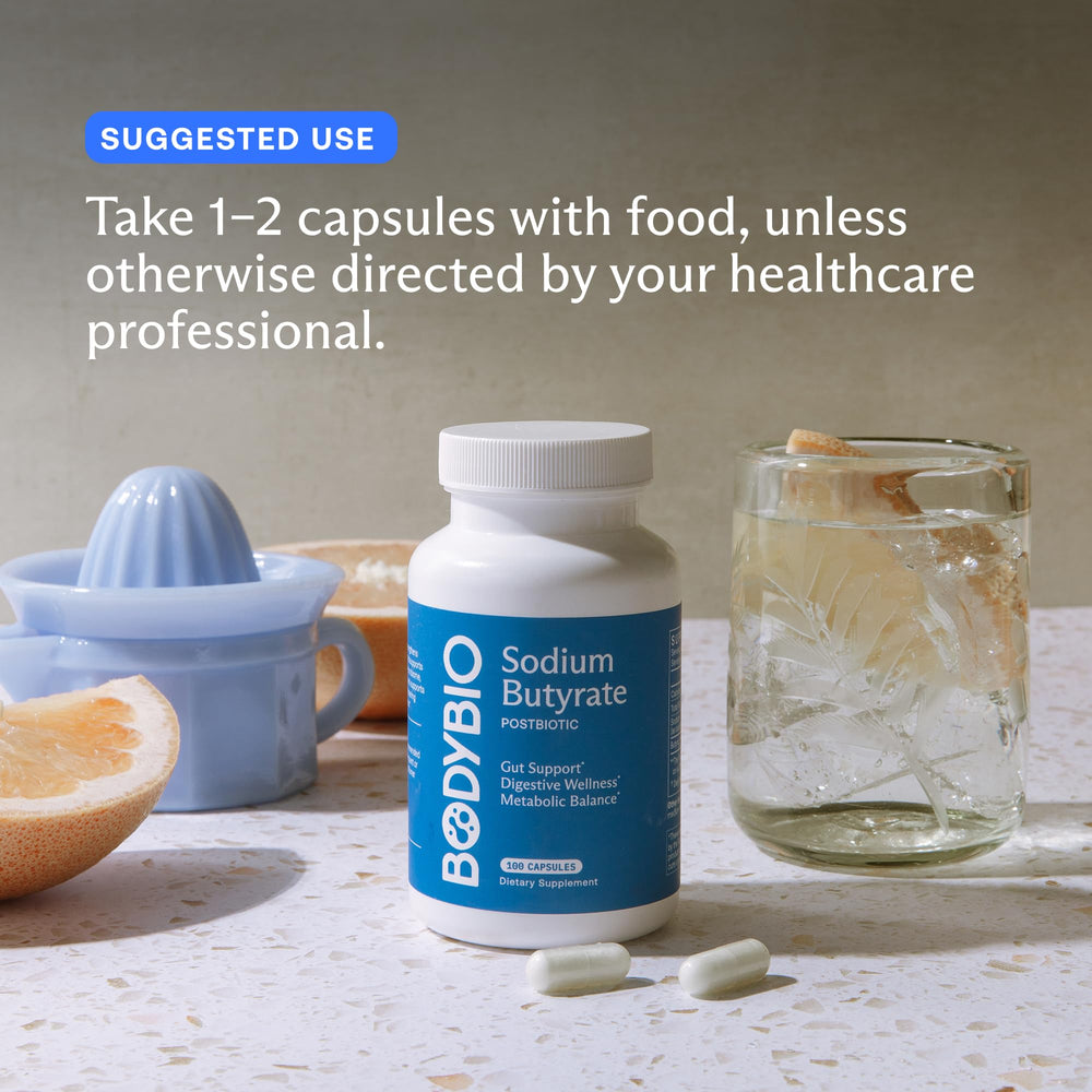Pouring BodyBio Butyrate bottle into glass illustrates convenient consumption.