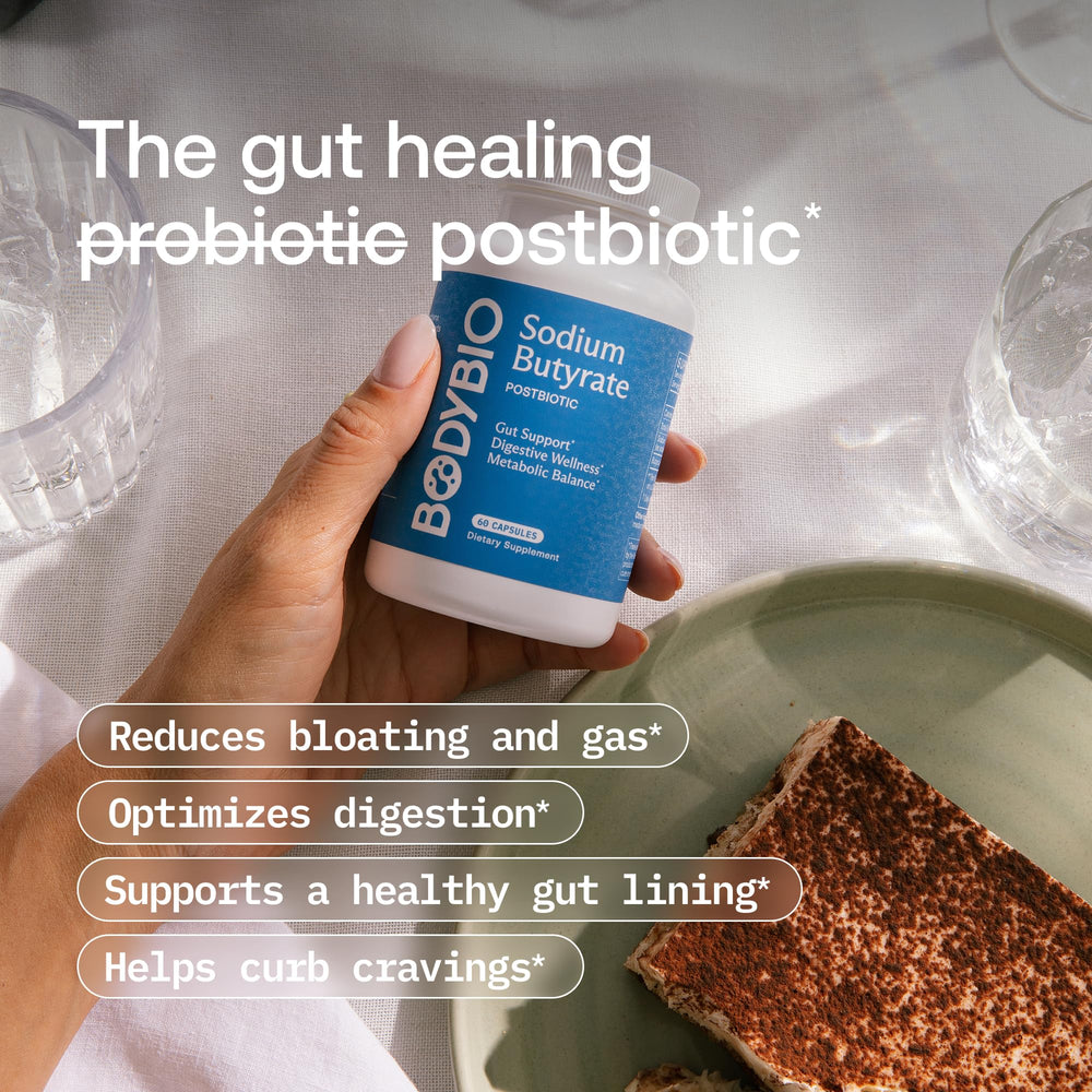 BodyBio Butyrate capsules in hand suggest easy daily gut support.