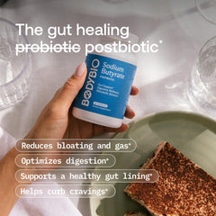 BodyBio Butyrate capsules in hand suggest easy daily gut support.