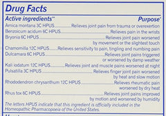 Close-up of Boiron Arnicare Arthritis tablets showing lactose-based formula