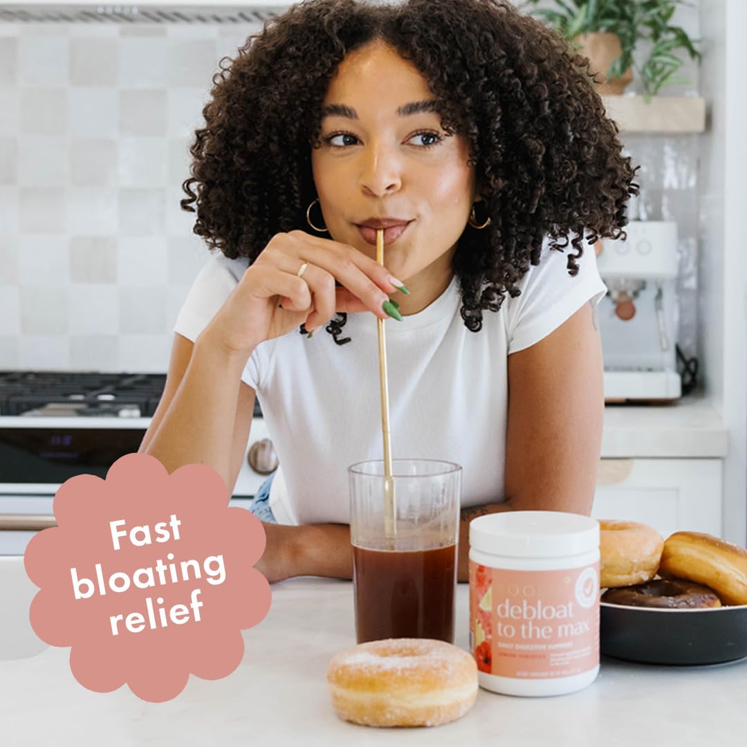 Boobie Debloat to the Max being poured into a glass for quick bloating relief.