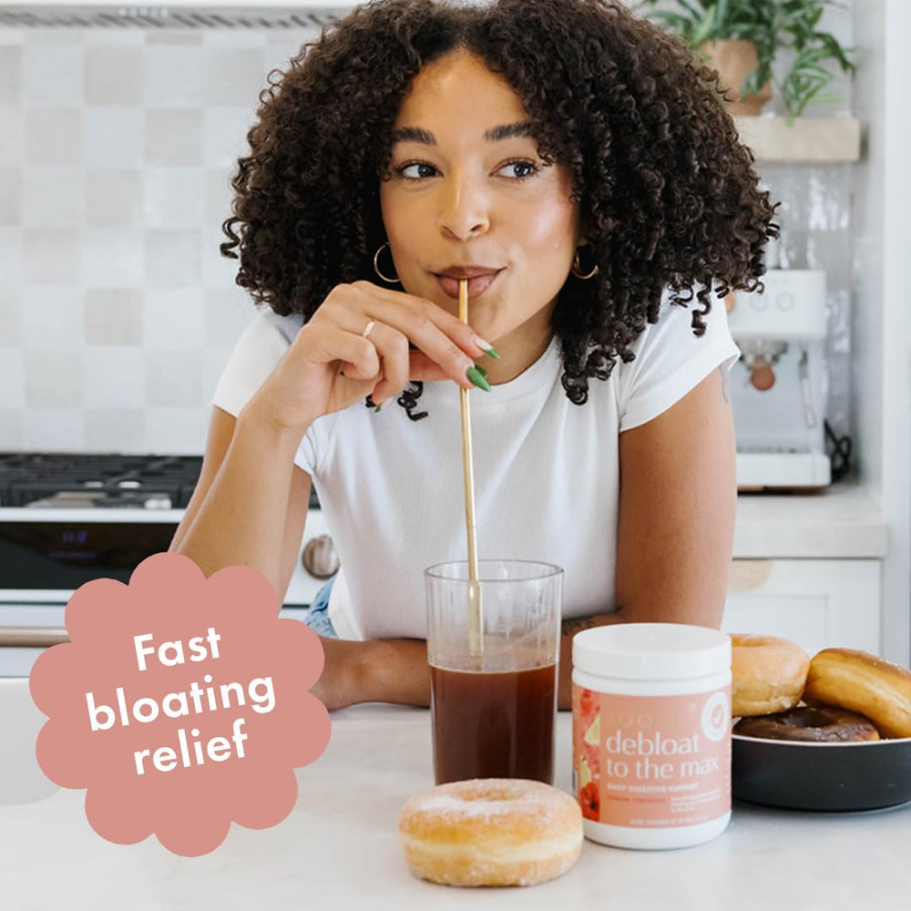 Boobie Debloat to the Max being poured into a glass for quick bloating relief.