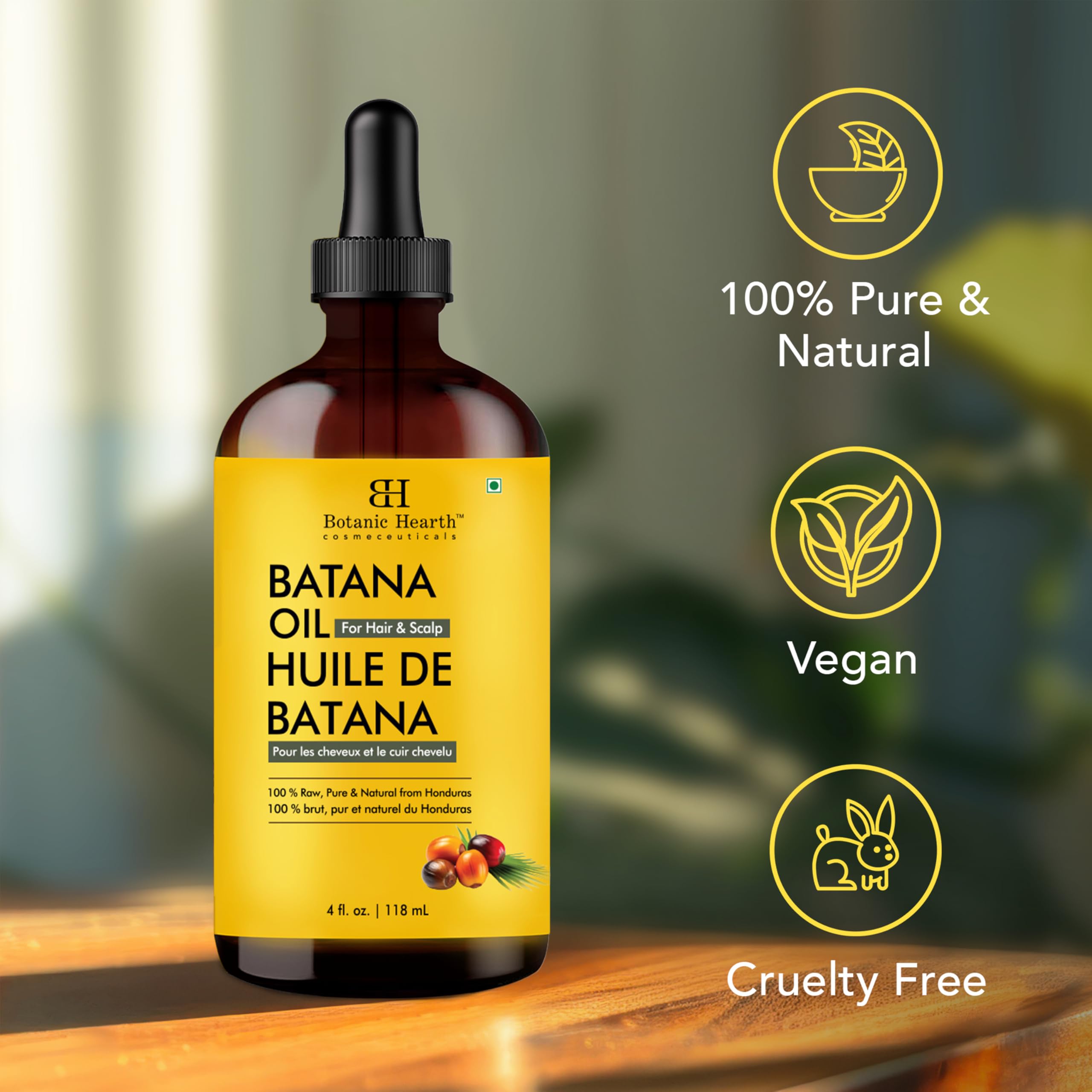 Botanic Hearth Batana Oil on scalp for potential vitality support.