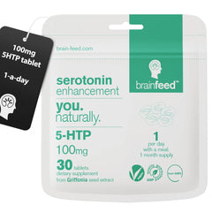 Brain Feed serotonin tablet close-up showing 100 mg 5-HTP for mood support.
