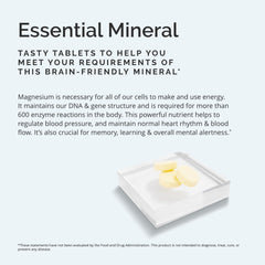 BrainMD magnesium chewables citrus serving with dispensed tablets on a countertop.
