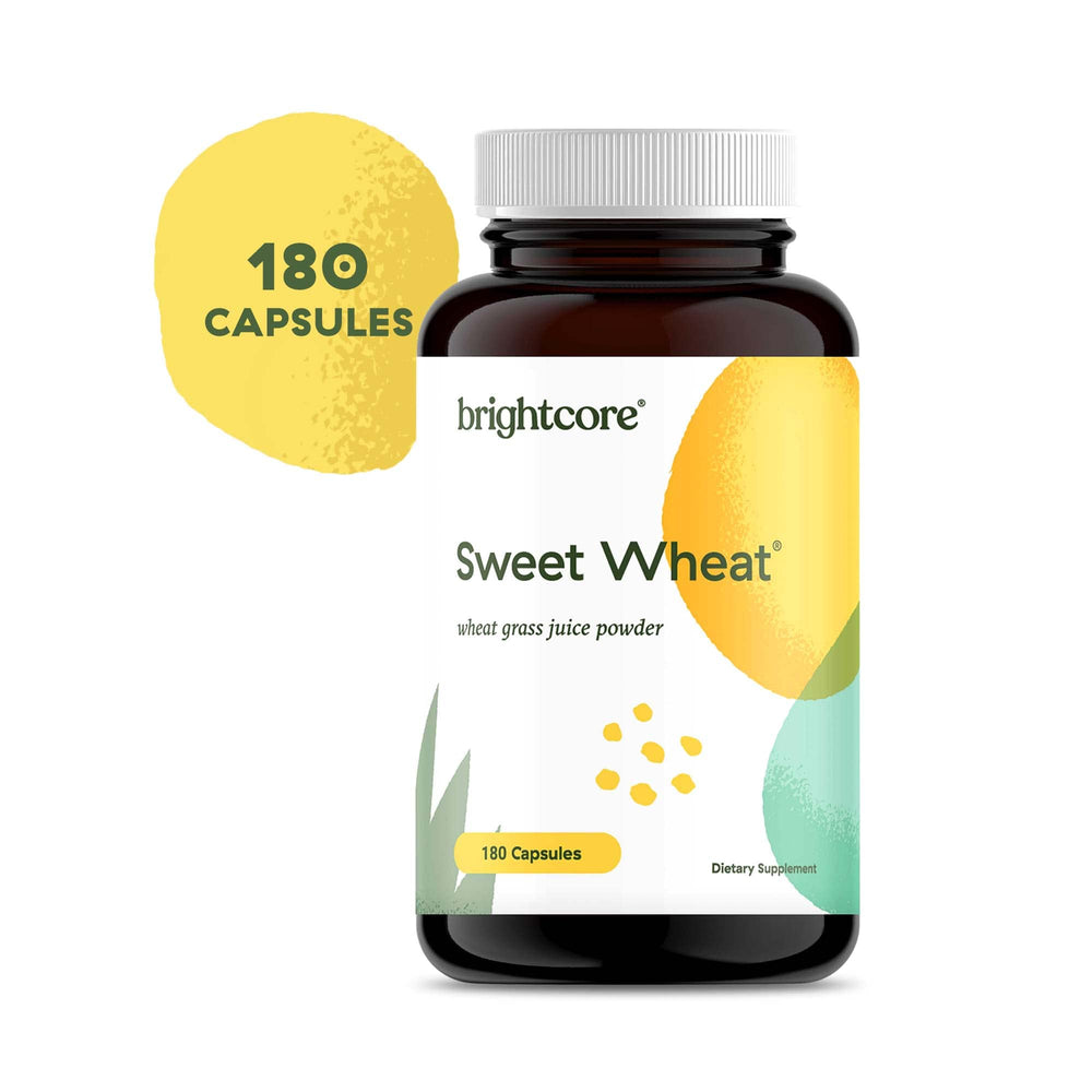 Brightcore Nutrition Sweet Wheat product beside berries and greens powder on countertop
