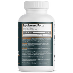 Close-up of Bronson Biotin mini-tablets ready for daily use.