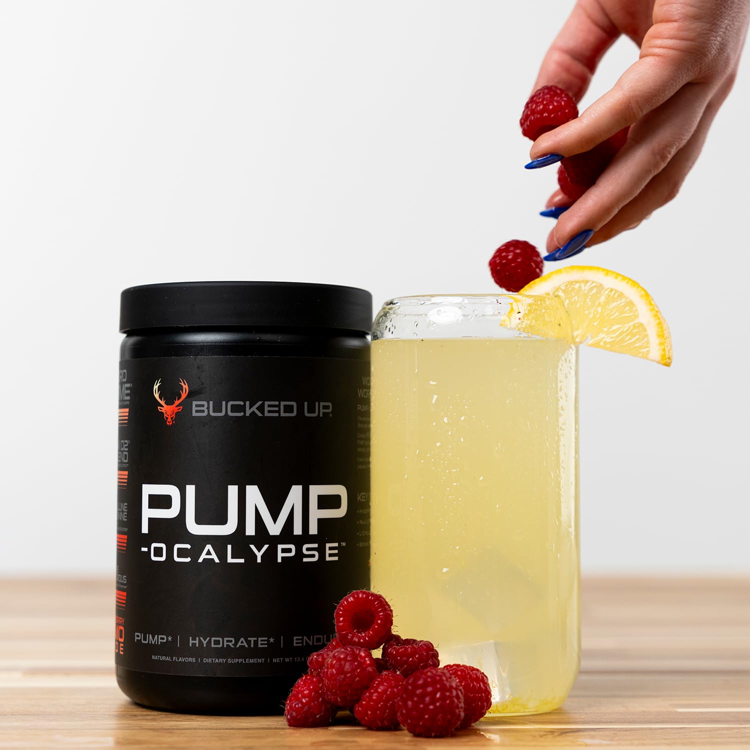 Bucked Up Pump-ocalypse Raspberry Lemonade beside timer during endurance workout.