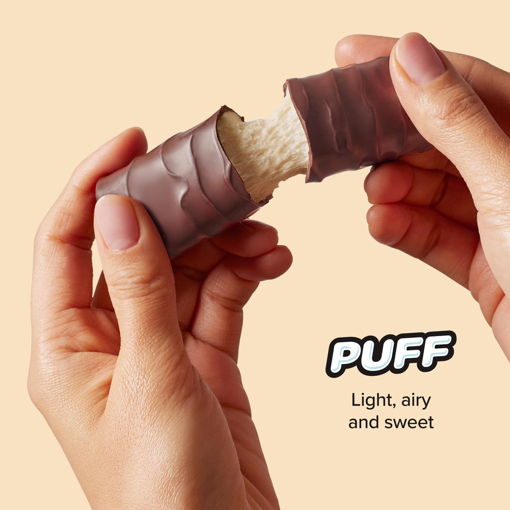 Built Bar Puff chocolate-coated bar resting on surface.