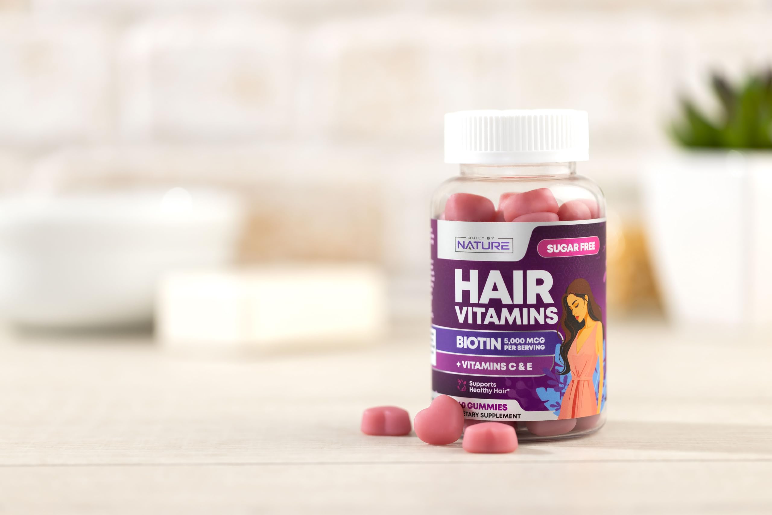 Built by Nature Hair Vitamins gummies close-up; vegan, non-GMO, and tasty flavor.