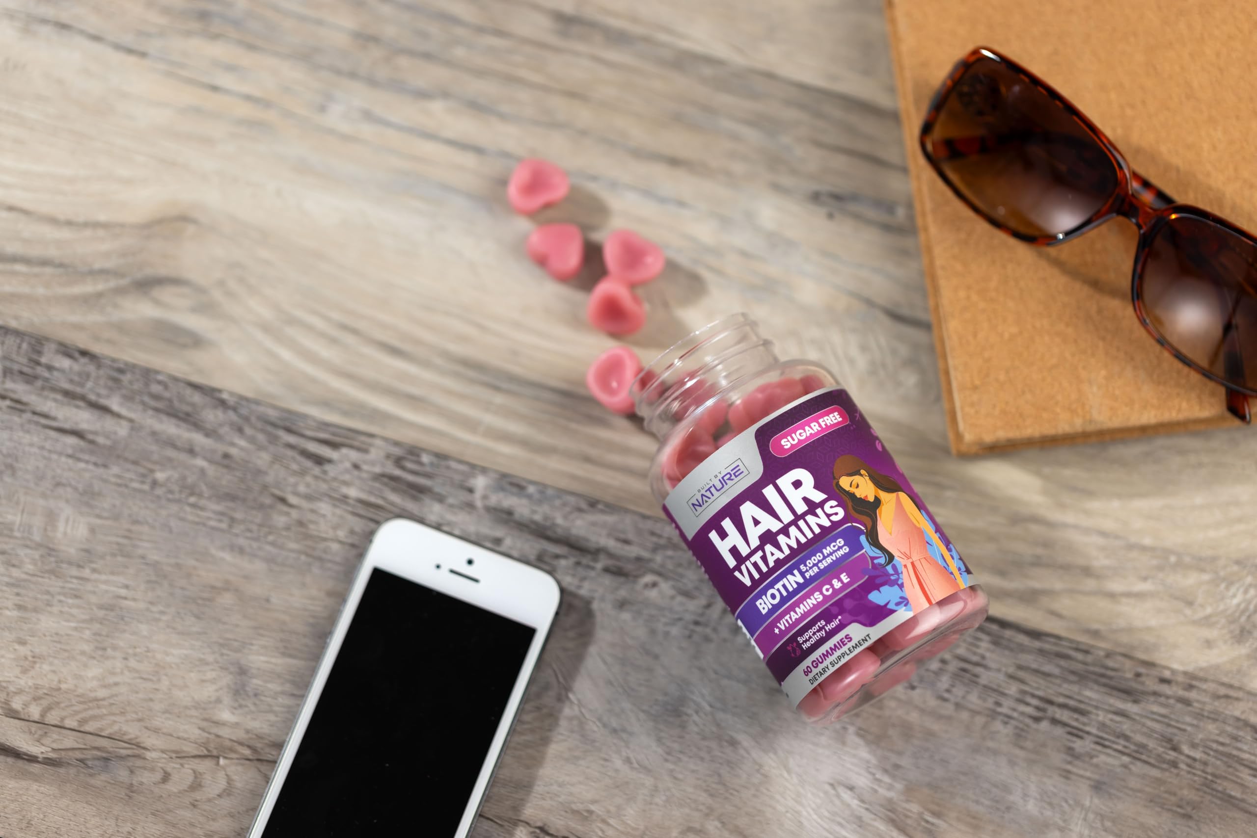 Built by Nature Hair Vitamins on vanity setup supports nails and radiant skin.